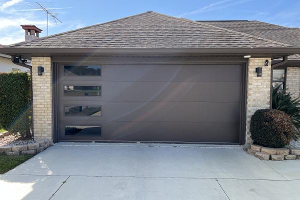 CHI Skyline Flush in Brown Model 4150 with Tinted Long Panel Windows installed by ABS Garage Doors in The W Section Palm Coast, Florida