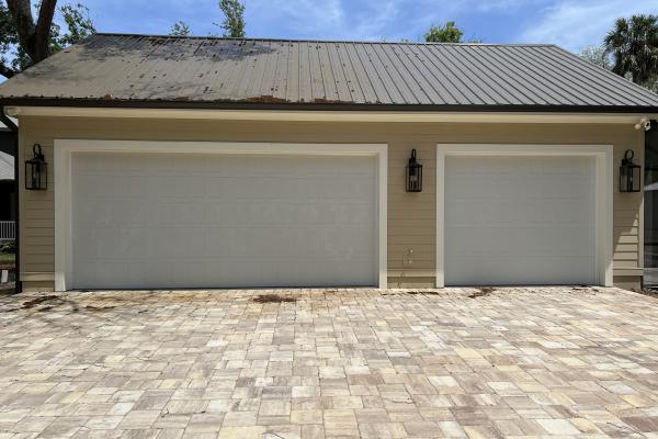 CHI model 2550 garage doors installed in Palm Coast, Florida by ABS Garage Doors.