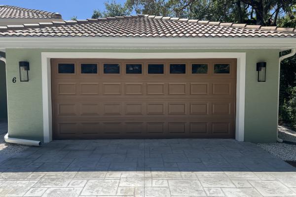 C.H.I. model 2250 garage door with Plain Glass Top Section installed by ABS Garage Doors in Palm Coast, Florida.