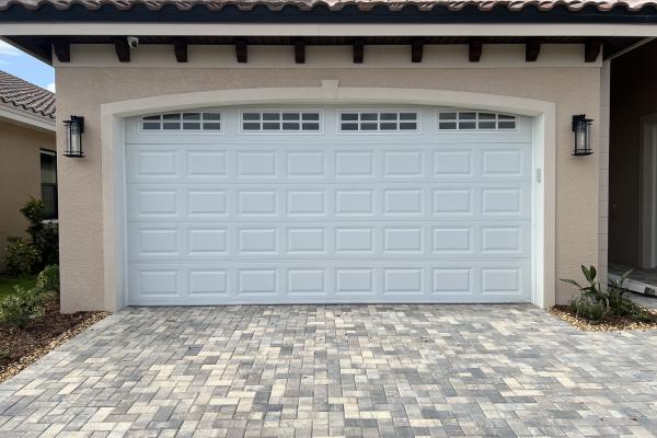 CHI 2250 garage door with arched stockton glass top section installed by ABS Garage Doors in Flagler Beach, Florida.