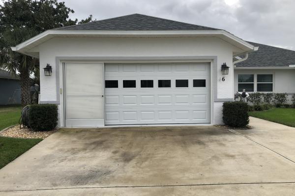 Raised Short Panel Garage Door with Plain Glass