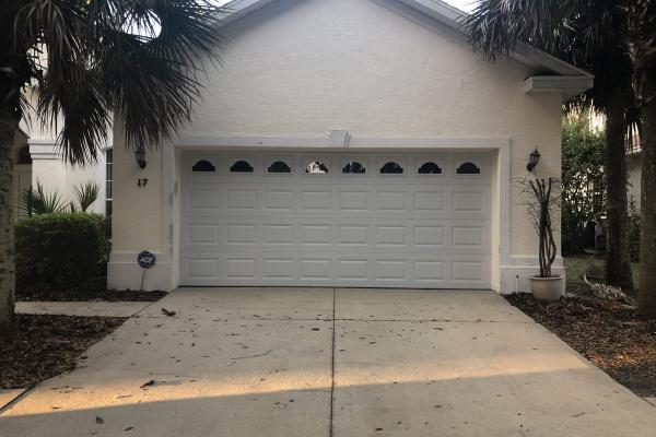 Raised Short Panel Garage Door with Glass Top Section and Cathedral Inserts